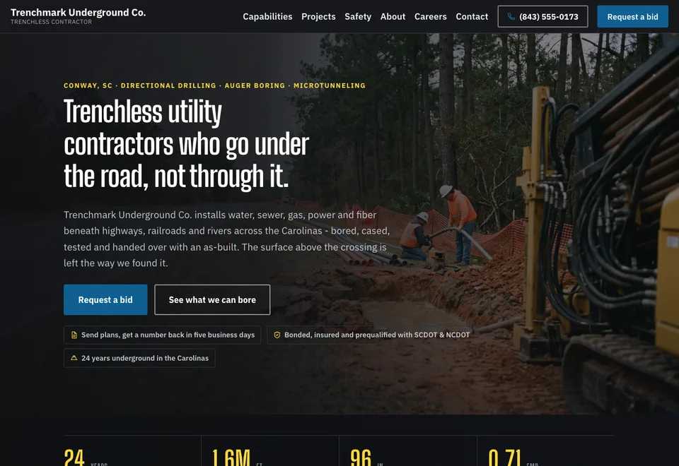 The Trenchmark Underground Co. demo home page, a trenchless utility contractor site led by a photograph of a bore crew and conduit at an open pit.